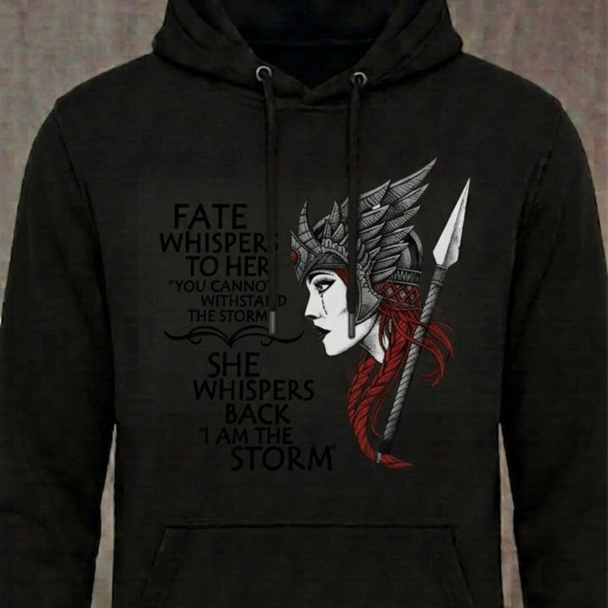 I Am The Storm distressed graphic unisex hoodie in black — bold women’s empowerment graphic — Reborn XII